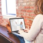 Woman working from home sitting on a bench