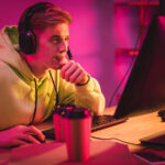 Focused gamer with a headset