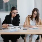 Two women doing research