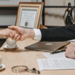 People Shaking Their Hands in Close Deal Business Contract