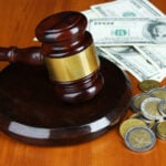 Some Disabilities That Are the Basis for Most Workers' Compensation Claims 9 Gavel and money on table