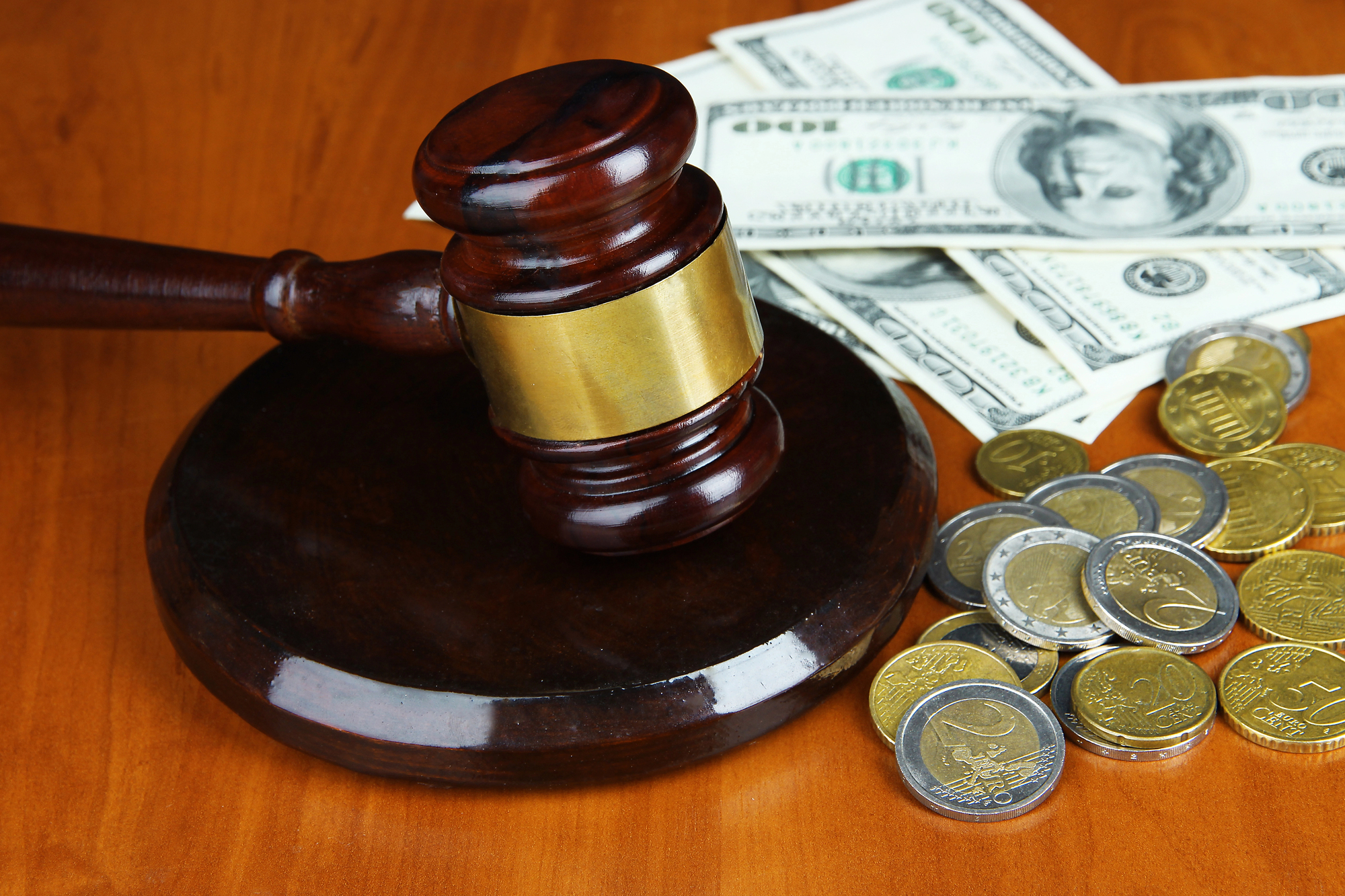 Gavel and money on table