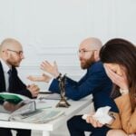 A couple talking with an attorney