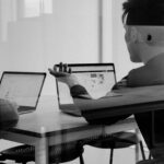 Employees looking at laptops