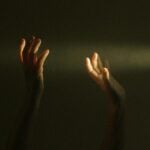 Persons Raising Hands