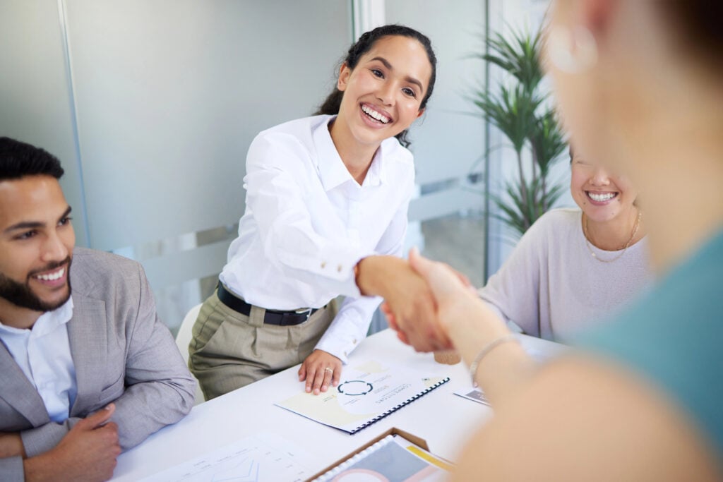 Business people, handshake and finance meeting in office