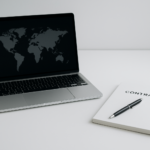 Laptop and notepad on a desk