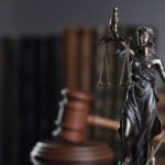 Law concept. Gavel of the judge, statue of the justice