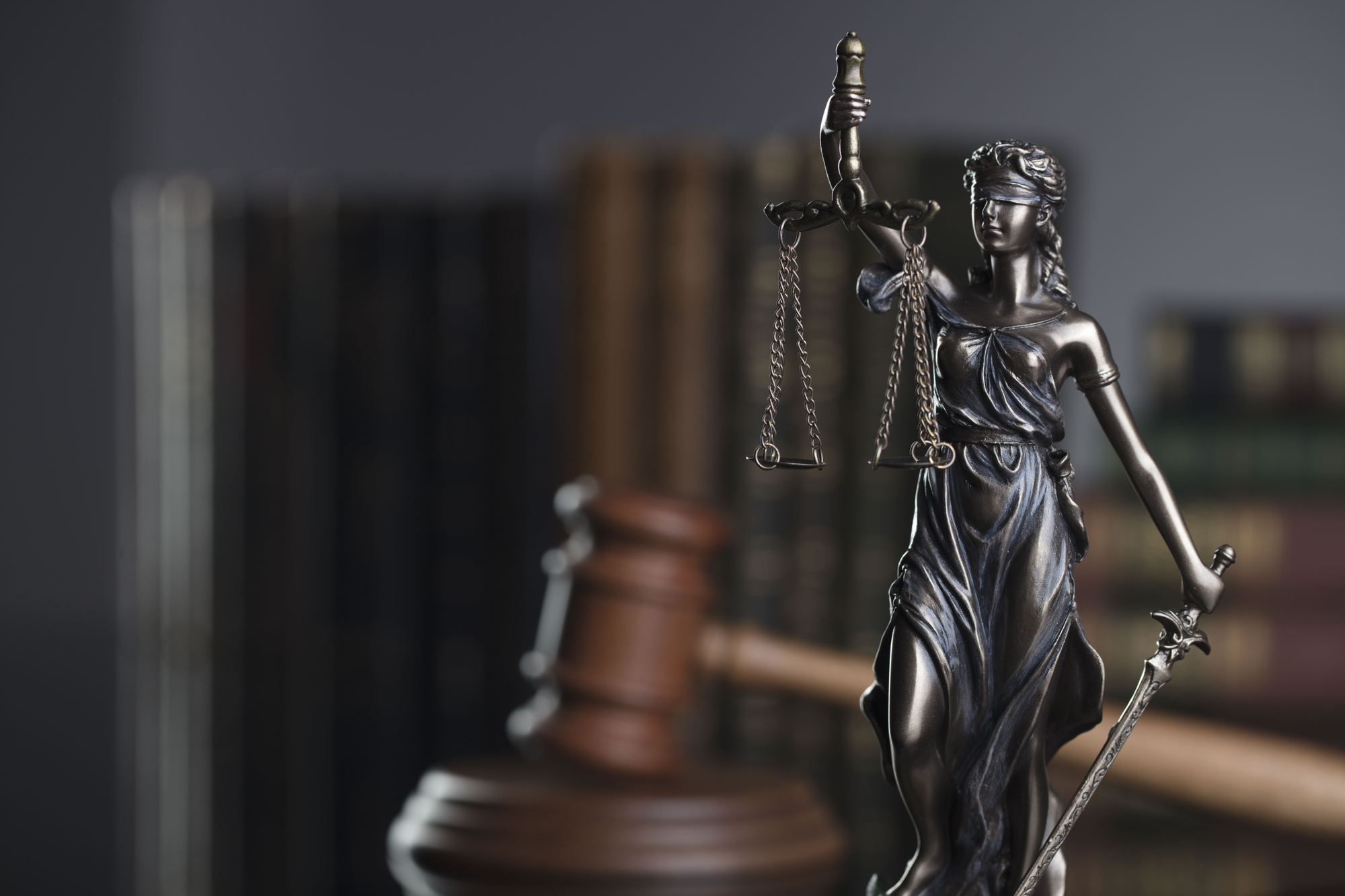 Law concept. Gavel of the judge, statue of the justice