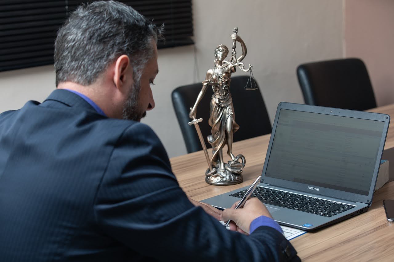 Attorney signing a document