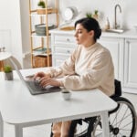 Disabled Woman Wheelchair Works Remotely Her Laptop