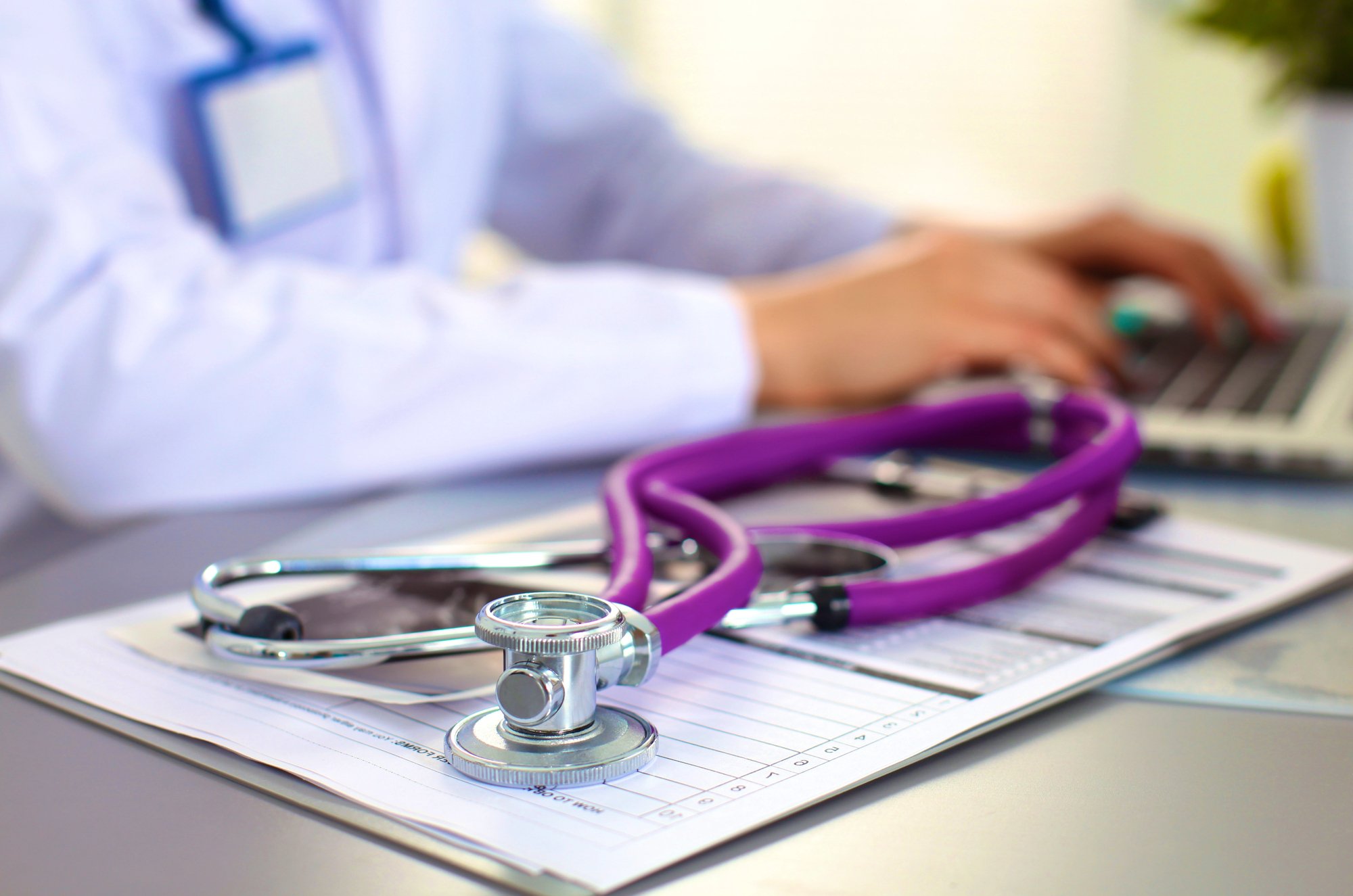 Female doctor at the office of the table