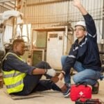 Injured employee being helped by a co-worker