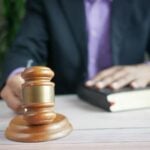 Man pounding a gavel on a desk