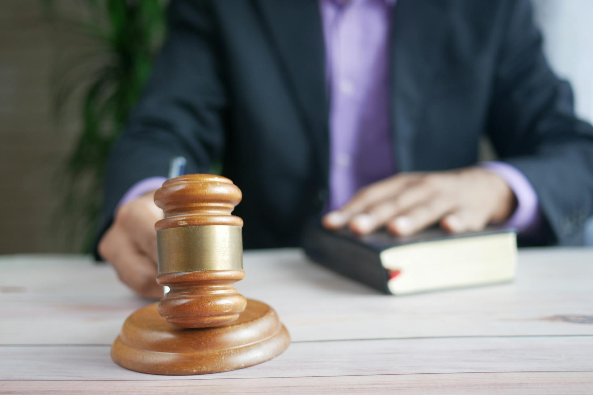 Man pounding a gavel on a desk