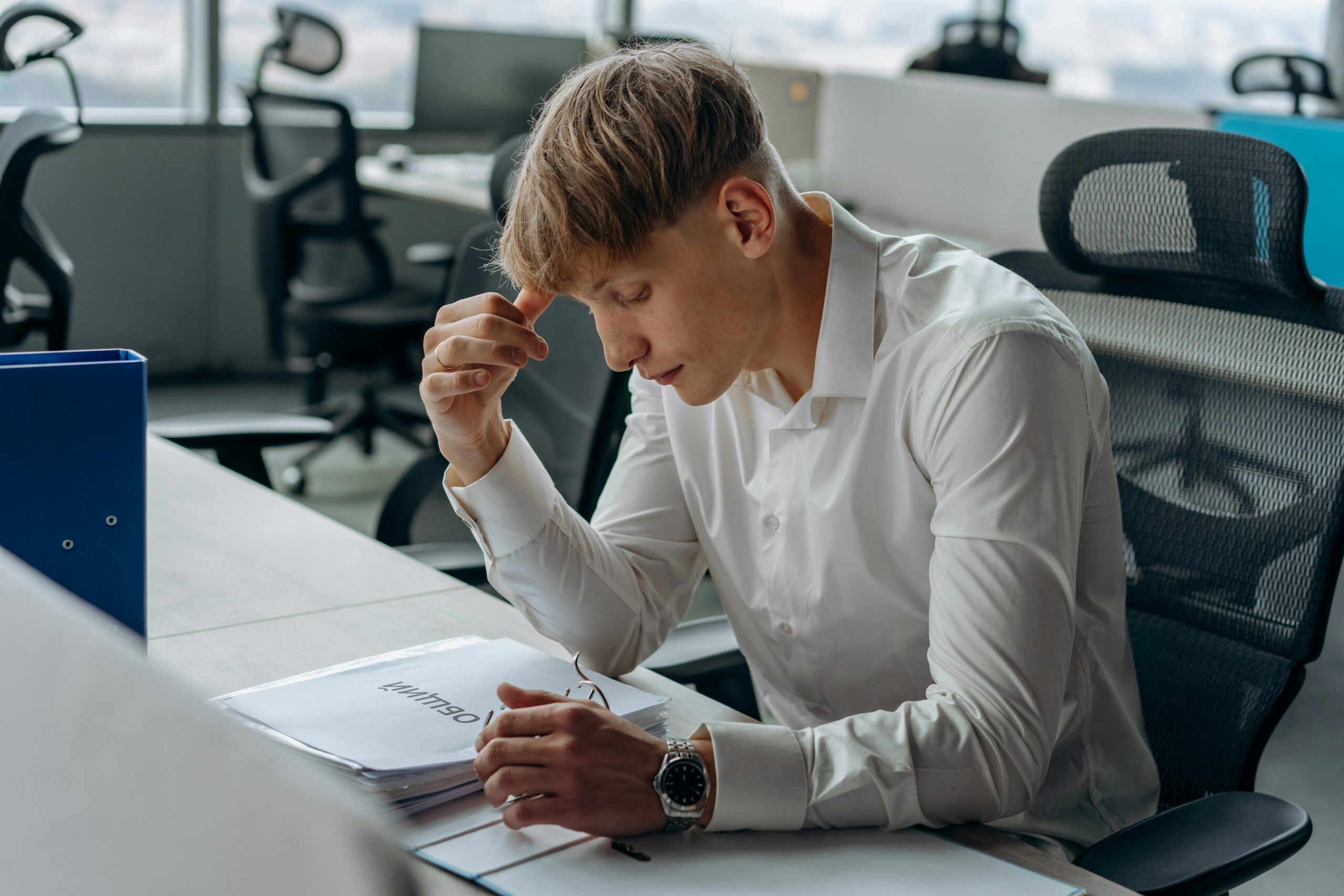 Man sitting at a desk looking at documents