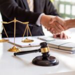 Attorney shaking hands with a client