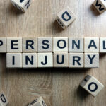 Personal injury text from wooden blocks on desk
