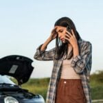 What to Do Immediately After a Car Accident Injury 6 Stressed female standing by a broken car