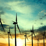 Wind turbines farm at sunset