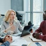 13 HR Tech Controls That Cut Workplace Liability 11 Woman in Gray Blazer Sitting by the Table Using Laptop
