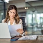 Woman reviewing a document at work