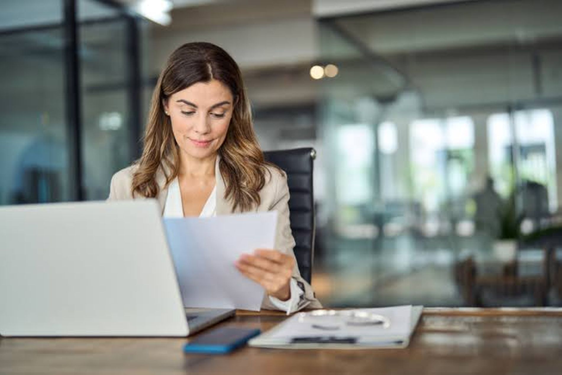 Woman reviewing a document at work