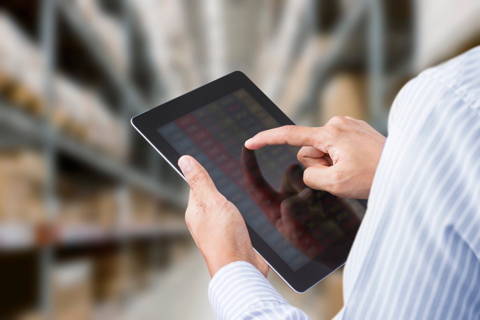 Businessman checking inventory in stock room
