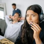 Compliance And Care: The Balance Every Service Company Must Strike 9 Close Up Photo of a Woman Wearing Headset at the Office