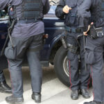 Who Can Legally Wear Plate Carriers in the U.S.? 8 Policeman in riot gear during a roadblock