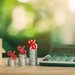 Why Mortgage Income Worksheets Simplify Approvals 9 House is placed on the coins and a calculator on the table