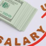 Stack of cash with salary up arrow