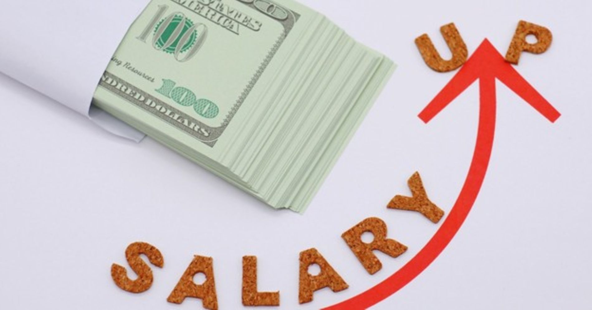 Stack of cash with salary up arrow