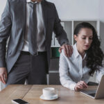 How to Recognize Subtle Sexual Harassment at Work 8 Businessman touching shoulder of secretary