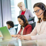 Customer service representative using laptop