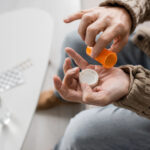 Man talking some prescribed medication