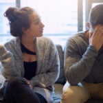 Divorce, conflict and couple on a couch