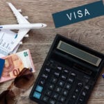 Flag of United States with passport and toy airplane