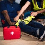 Injured employee being treated by an co-worker