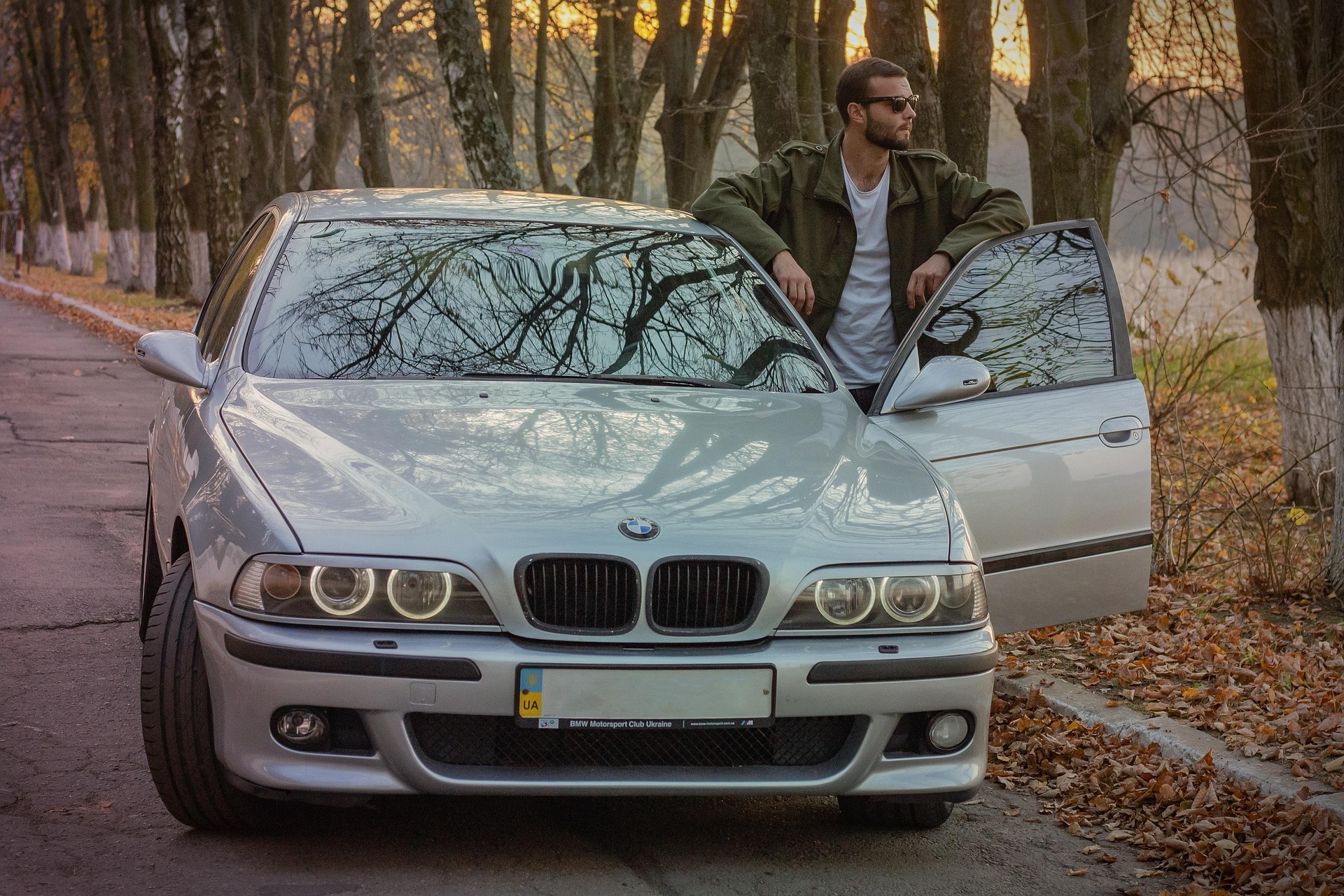 Man standing by a car Man standing by a car