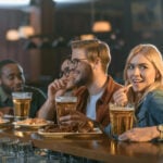 Attractive Multiculture Friends Eating Drinking Bar