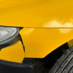 Protecting Your Legal Rights in Minor Car Accidents 7 Close-up of Damaged Yellow Car Front Bumper