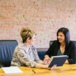 Women talking at a table