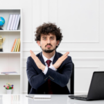 Attorney sitting in front of a desk crossing his arms