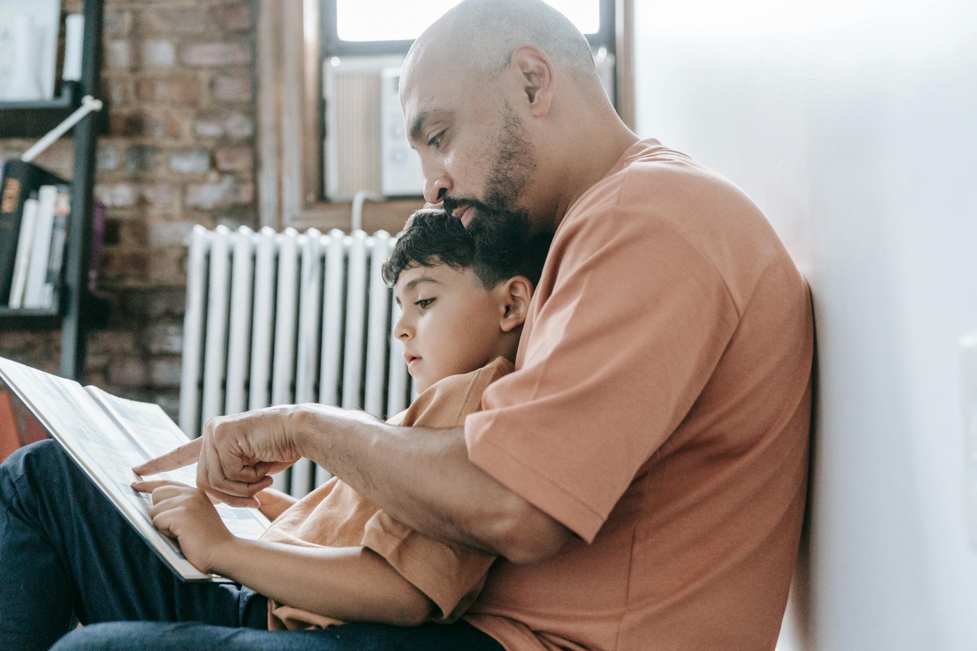 A father teaches his son to read