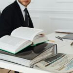 A lawyer sitting at a desk with legal books