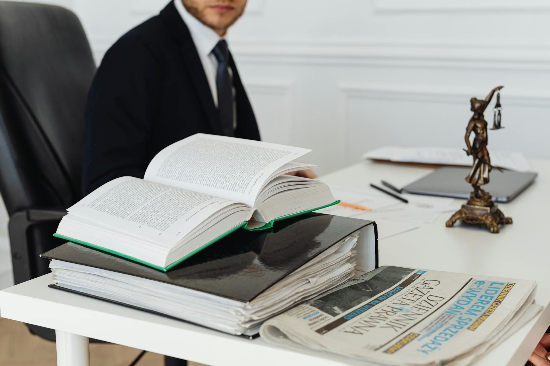 A lawyer sitting at a desk with legal books
