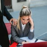 Businesswoman in stress at outdoor table