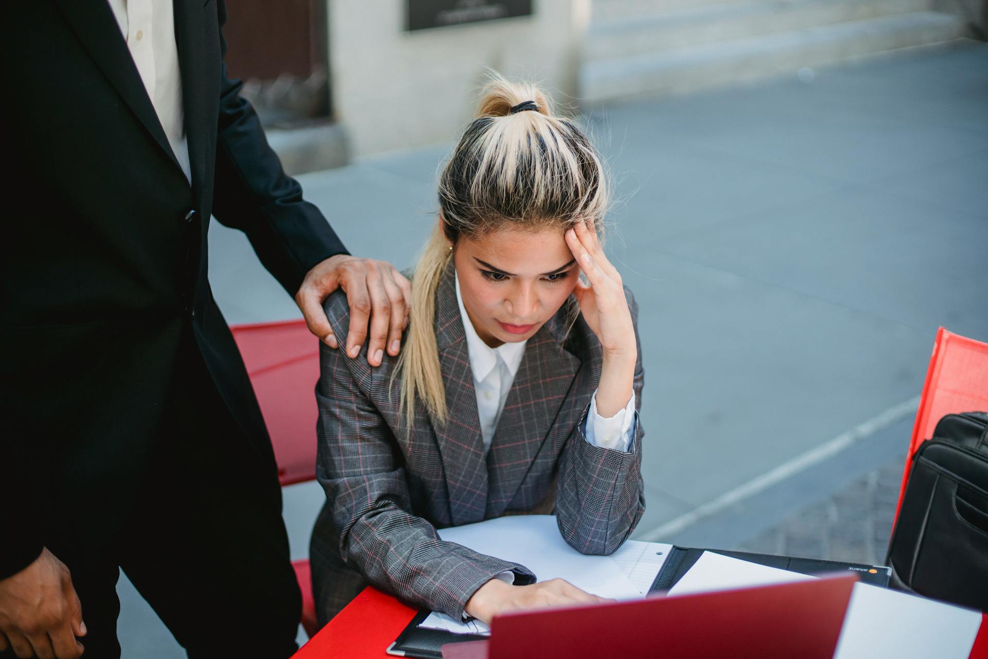 Businesswoman in stress at outdoor table