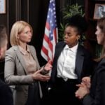 AI Hiring Bias Liability Is Why Online Paralegal Programs Now Cover Employment Tech Law 11 Diverse group of professionals in a discussion in a formal setting with an American flag